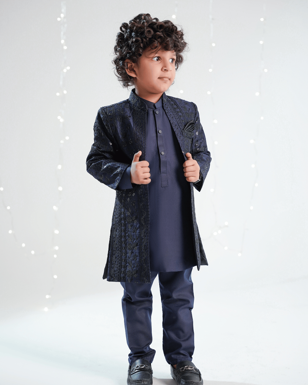 Boy wearing a navy blue premium open sherwani with embroidered fabric and wash & wear kurta trouser, perfect for weddings and formal occasion